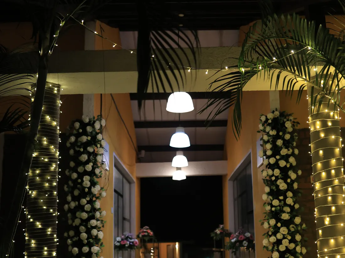 Floral pillars and pendant lamps in the courtyard at Nehamrit Farms