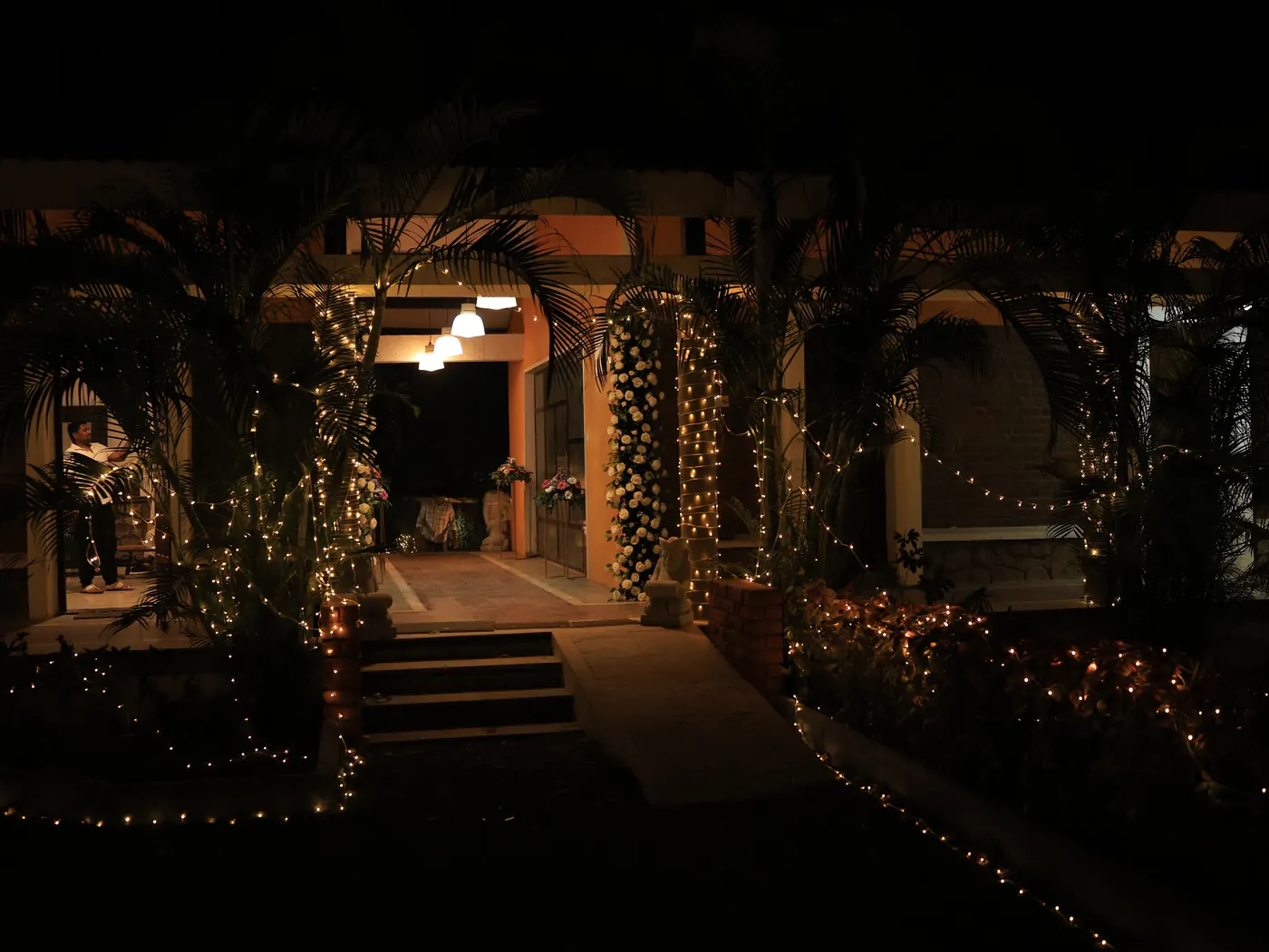 The path and steps at Nehamrit Farms lit for a wedding evening